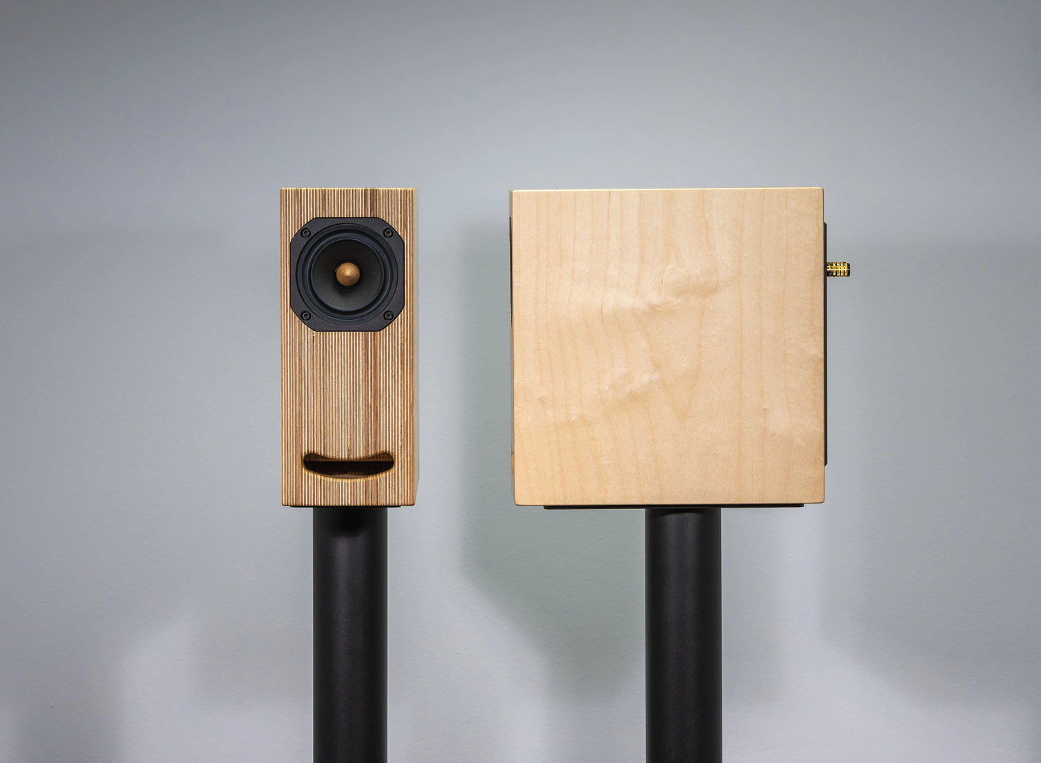 plywood loudspeaker on black stand