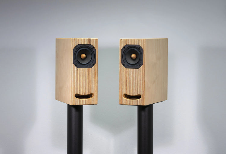 plywood loudspeaker on black stand