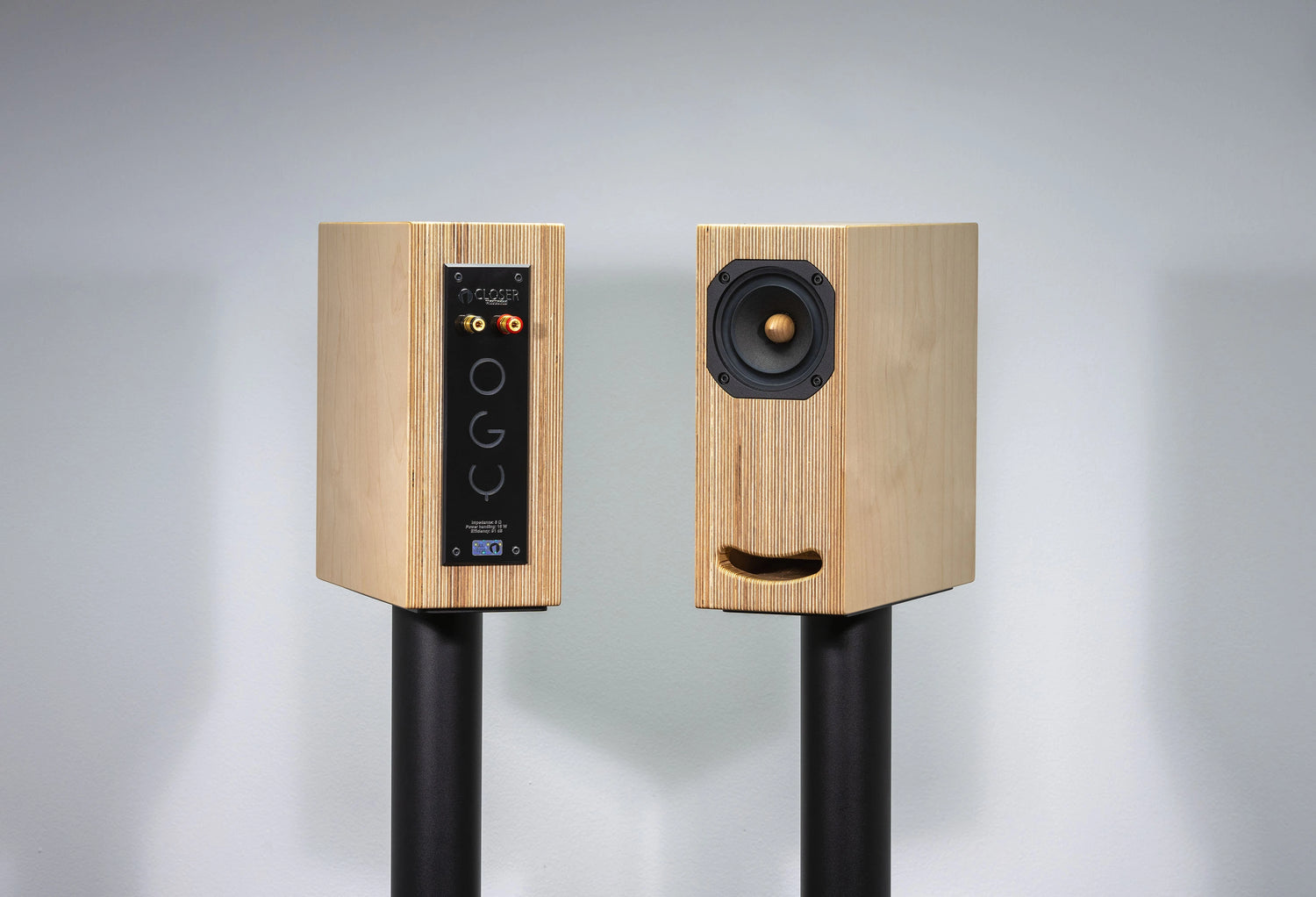 plywood loudspeaker on black stand